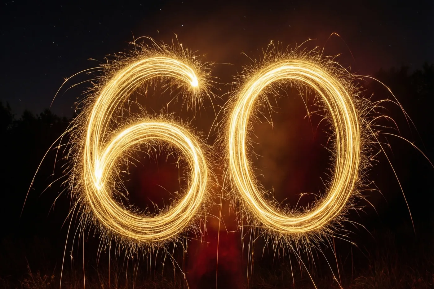 Gouden lichtsporen van sterretjes vormen 60 tegen een donkere nachthemel met zwak zichtbare sterren.