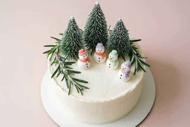 Vier sneeuwpopjes vieren Kerst